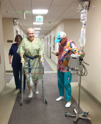 Taking a walk with my nurse and my wife, three hours after surgery