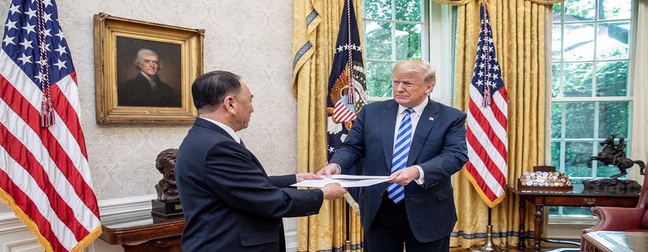 Donald Trump is presented with a letter from North Korean Leader Kim Jong Un, Friday, June 1, 2018, by North Korean envoy Kim Yong Chol in the Oval Office at the White House in Washington, D.C., followed by a meeting. (images by Shealah Craighead)