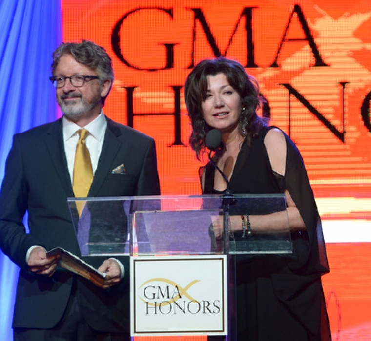 Songwriter Brown Bannister being inducted into the GMA Hall of Fame presented by singer-songwriter Amy Grant during the GMA Honors Celebration 2014