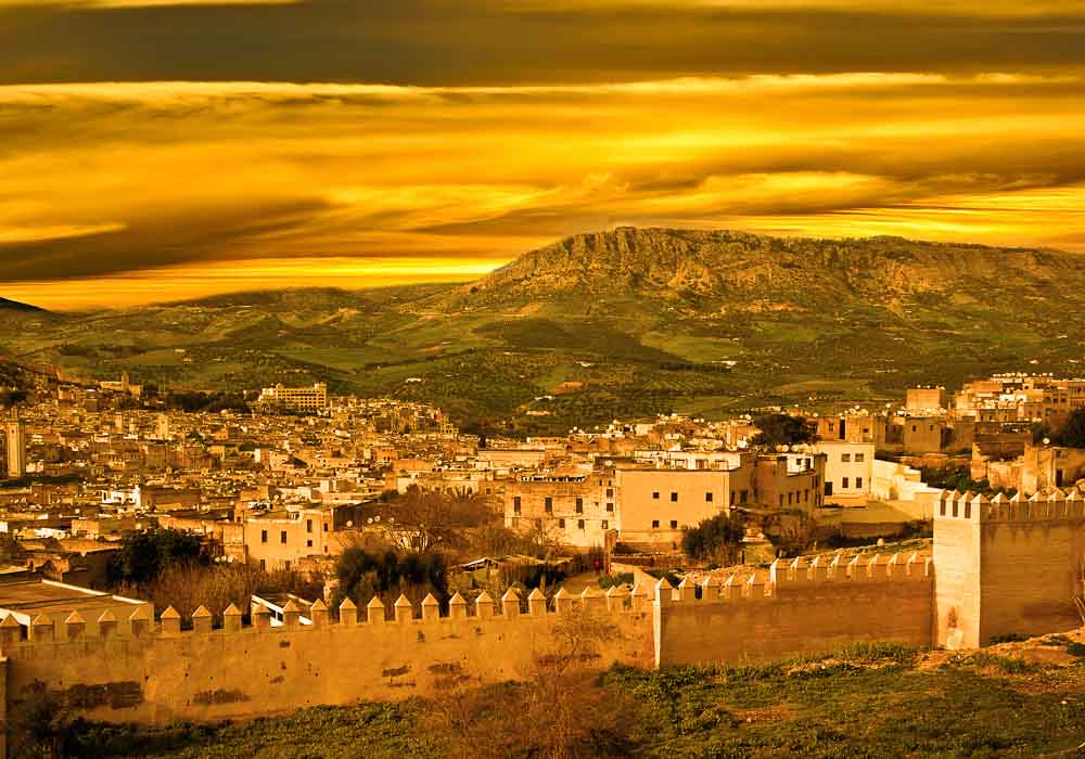 Landscape of Fez, Morocco showing the city wall  (Image: Much Morocco).