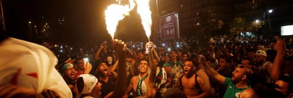 Algerian fans celebrate 2nd AFCON win as police clash with Paris fans.