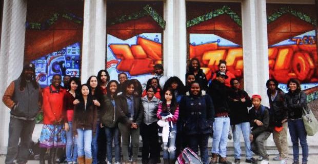 Helping those that Have Fallen through the Cracks. A group of Chicago South Side youths unveil this mural for a Garrett Popcorn Shop.