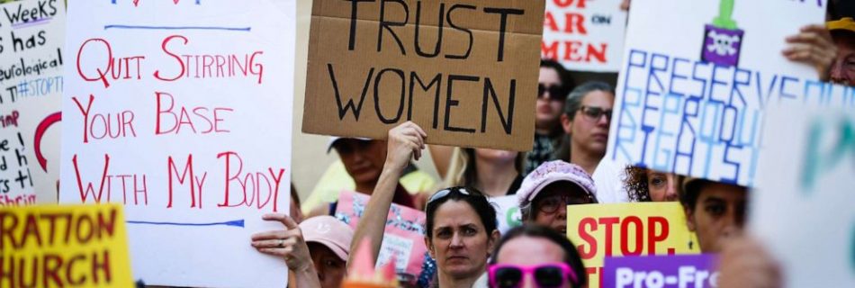 Women hold signs during a protest against recently passed abortion ban bills at the Georgia State Capitol building, in Atlanta, May 21, 2019 (Elijah Nouvelage/Getty Images)