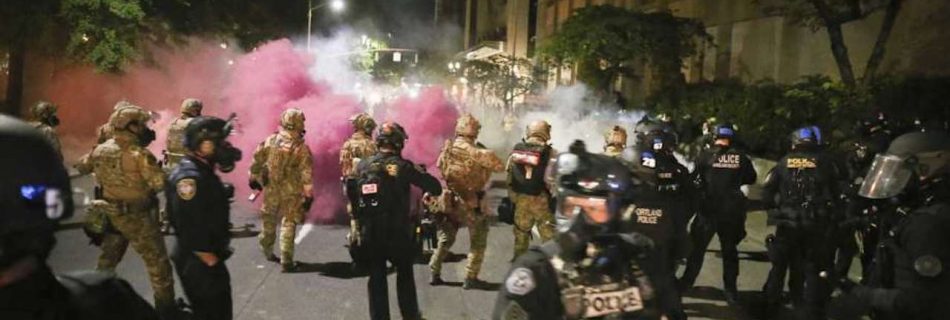 Oregon sues feds over Portland protests as unrest continues. Militarized federal agents deployed by the president to Portland, fired tear gas against protesters again overnight (Image by Dave Killen:AP)