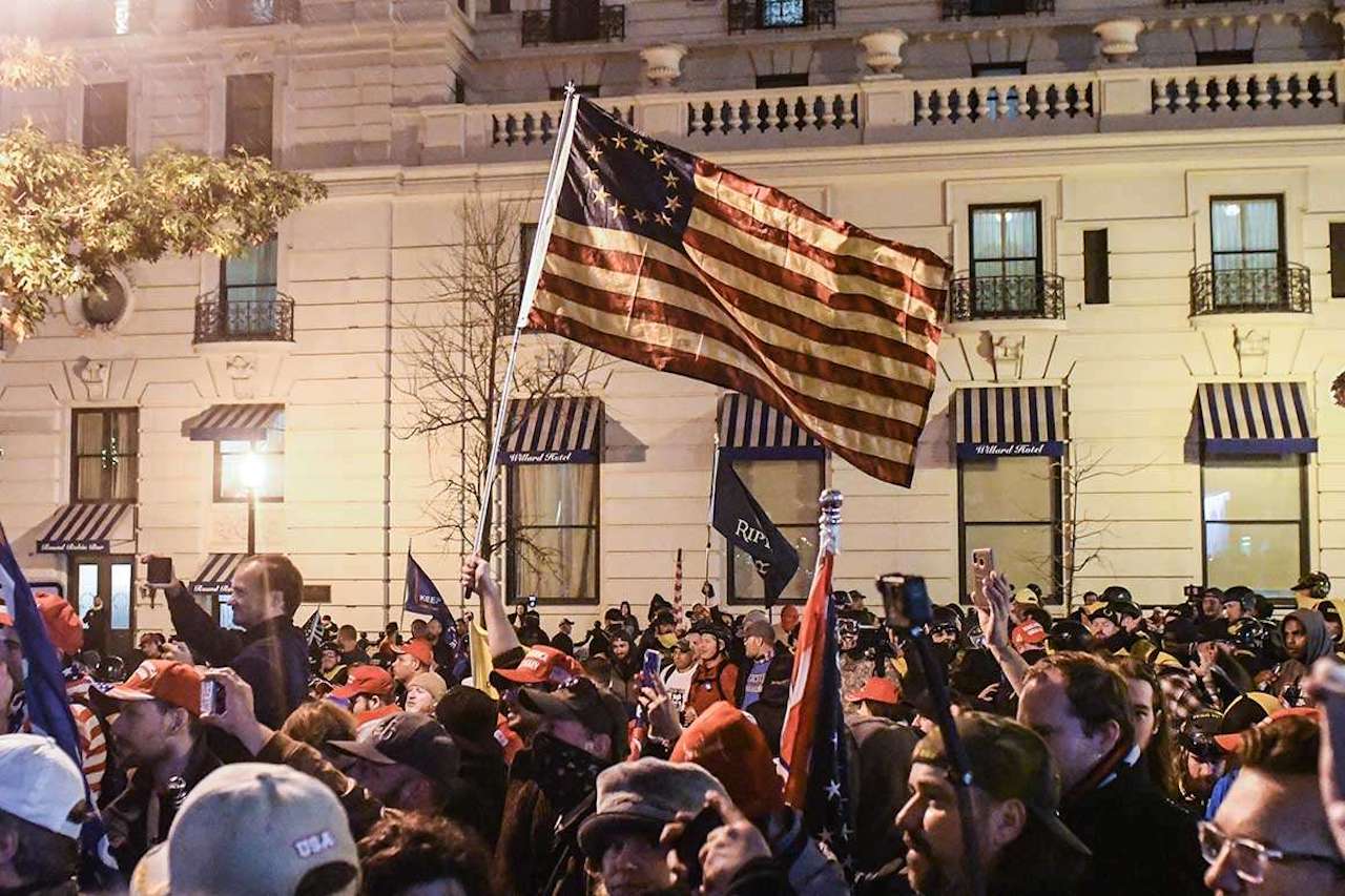 Supporters of President Donald Trump wave a Betsy Ross flag with a circle of 13 five-point stars representing the 13 original colonies flies during a protest Dec. 12 in Washington (© Stephanie Keith/Getty Images)